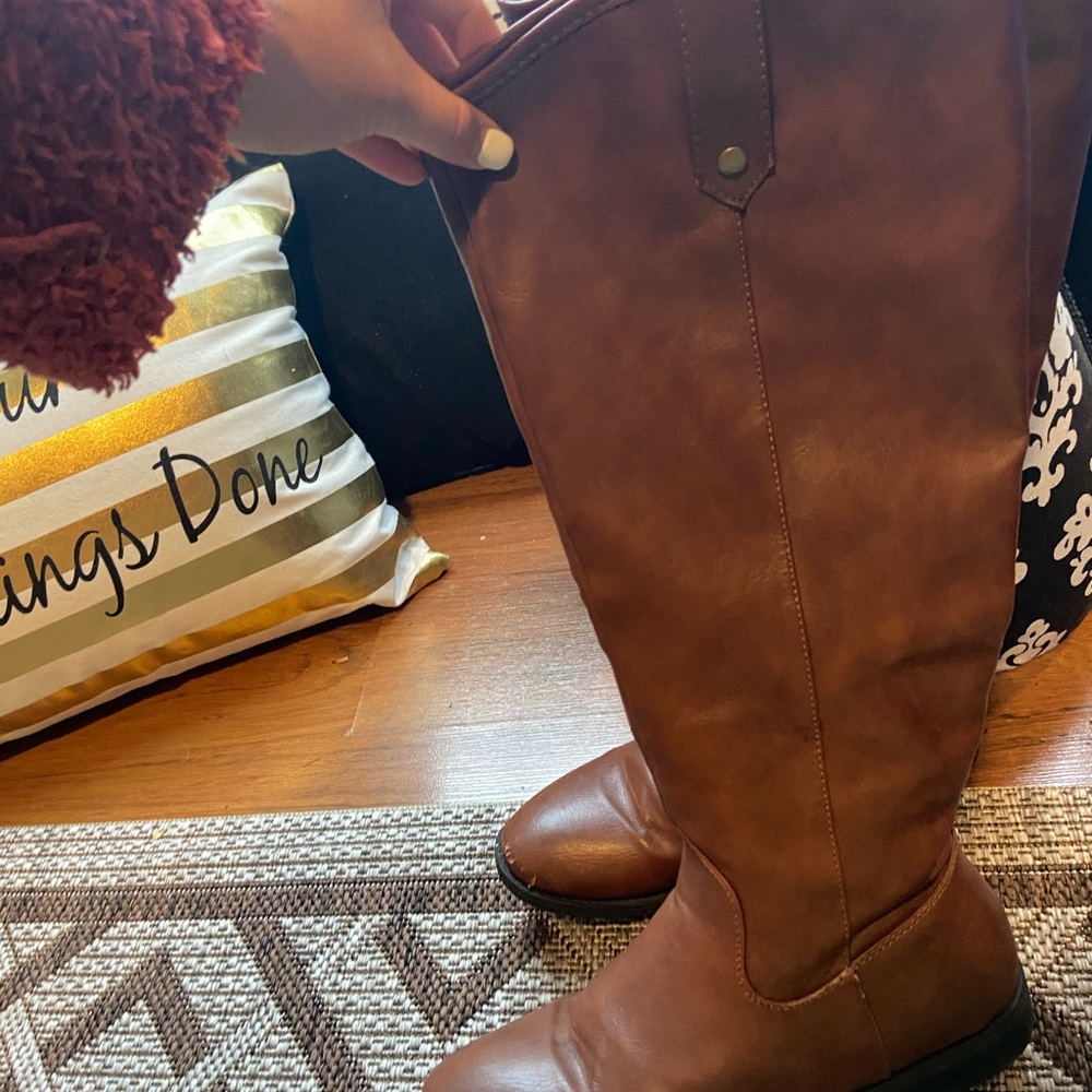 Brown tall boots. Perfect for fall.